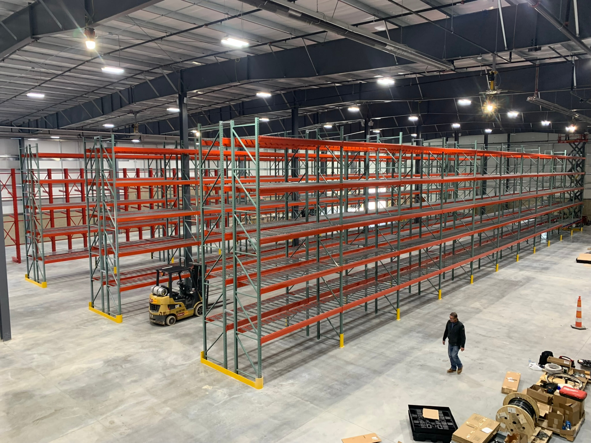 Rows of pallet rack installed in a new warehouse building